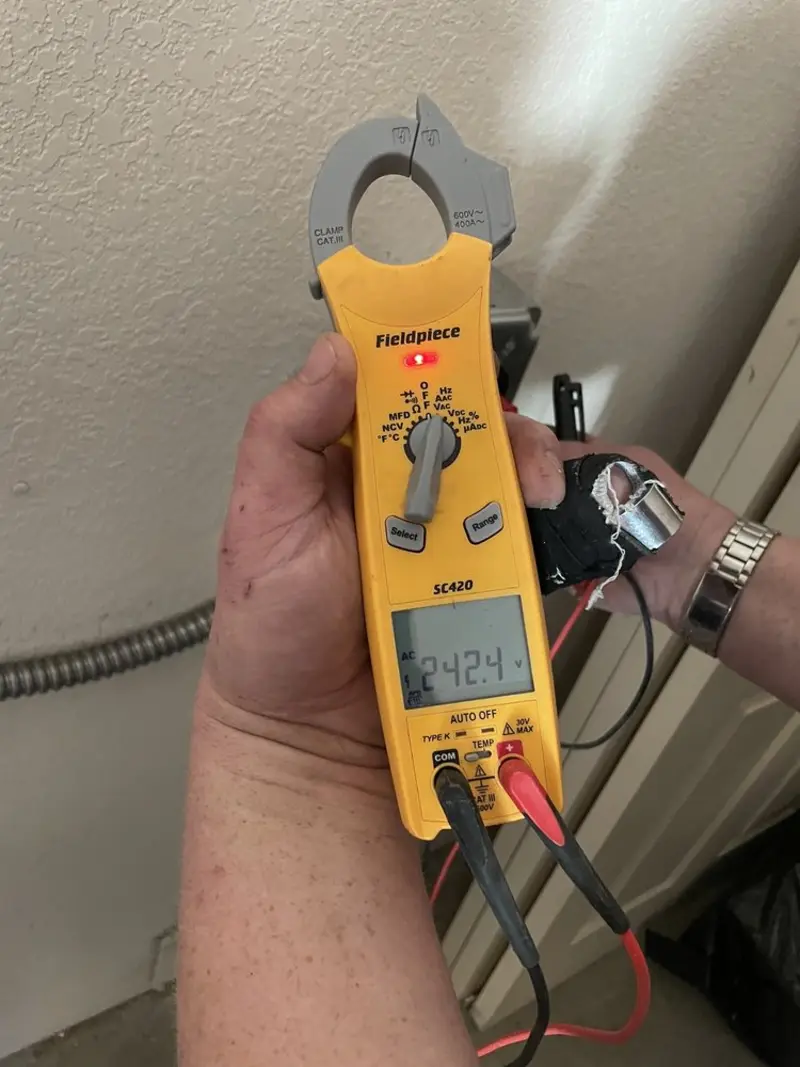 Voltage testing with clamp meter during Generator Installation in Palm Springs North